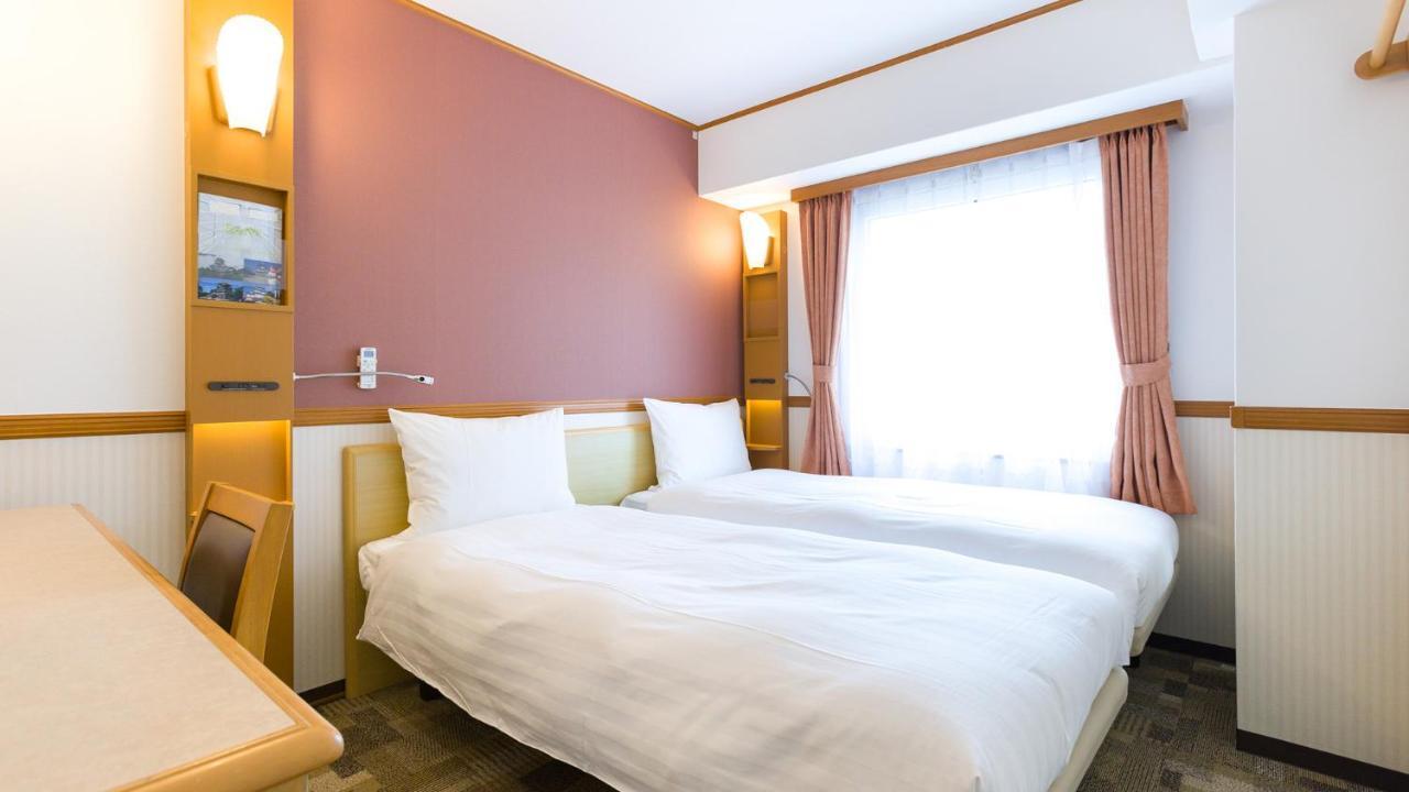 Toyoko Inn Tokyo Shinagawa-Eki Takanawa-Guchi Extérieur photo